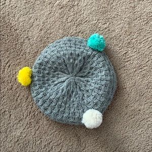 Winter hat with Pom Poms on it